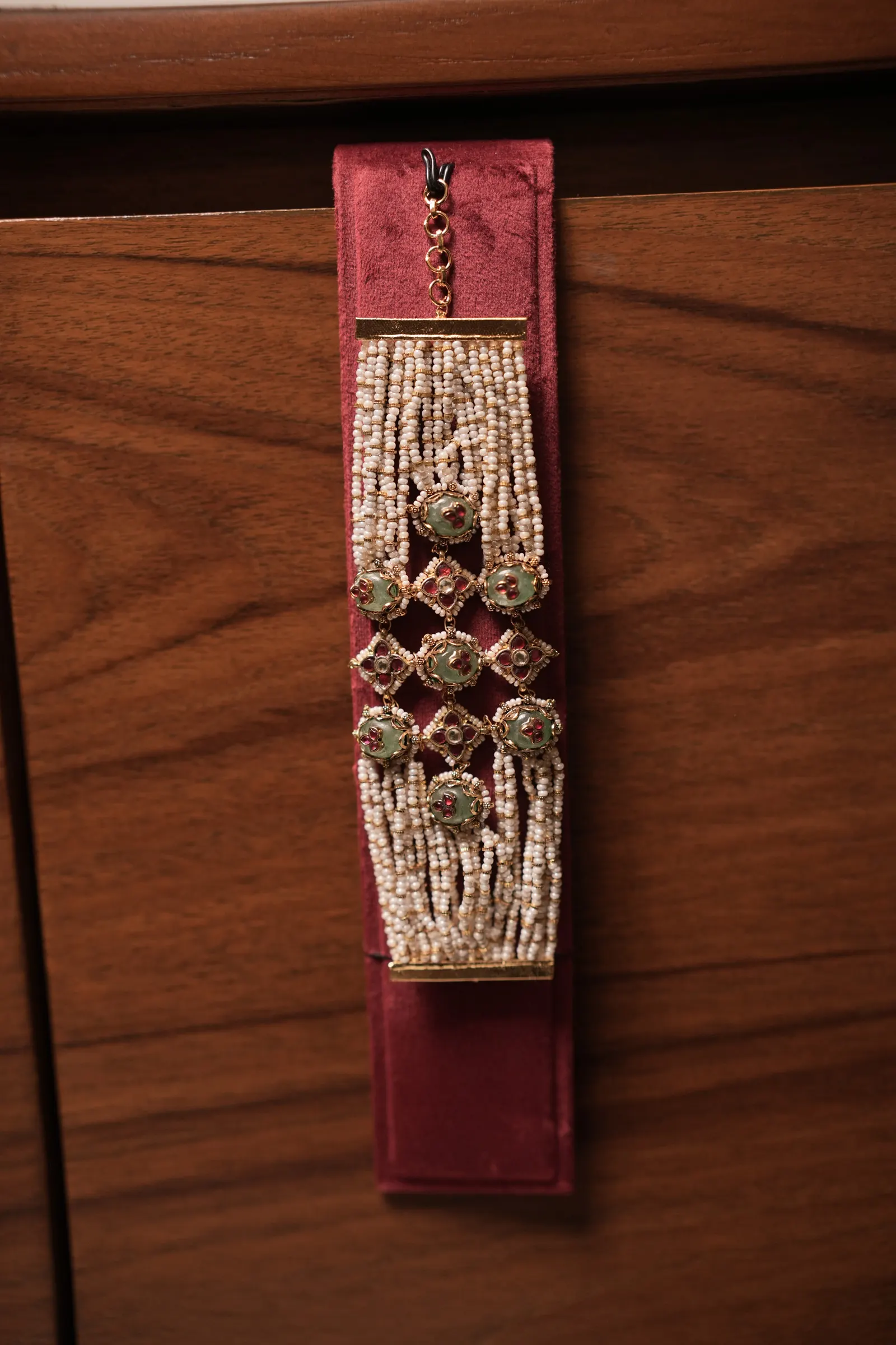 Pearl strand bracelet: Pearls, rubies, emeralds